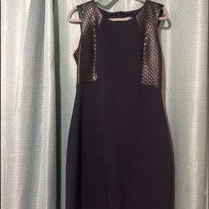 Dark Navy Guess mid length dress with a cage style back.faux leather accents